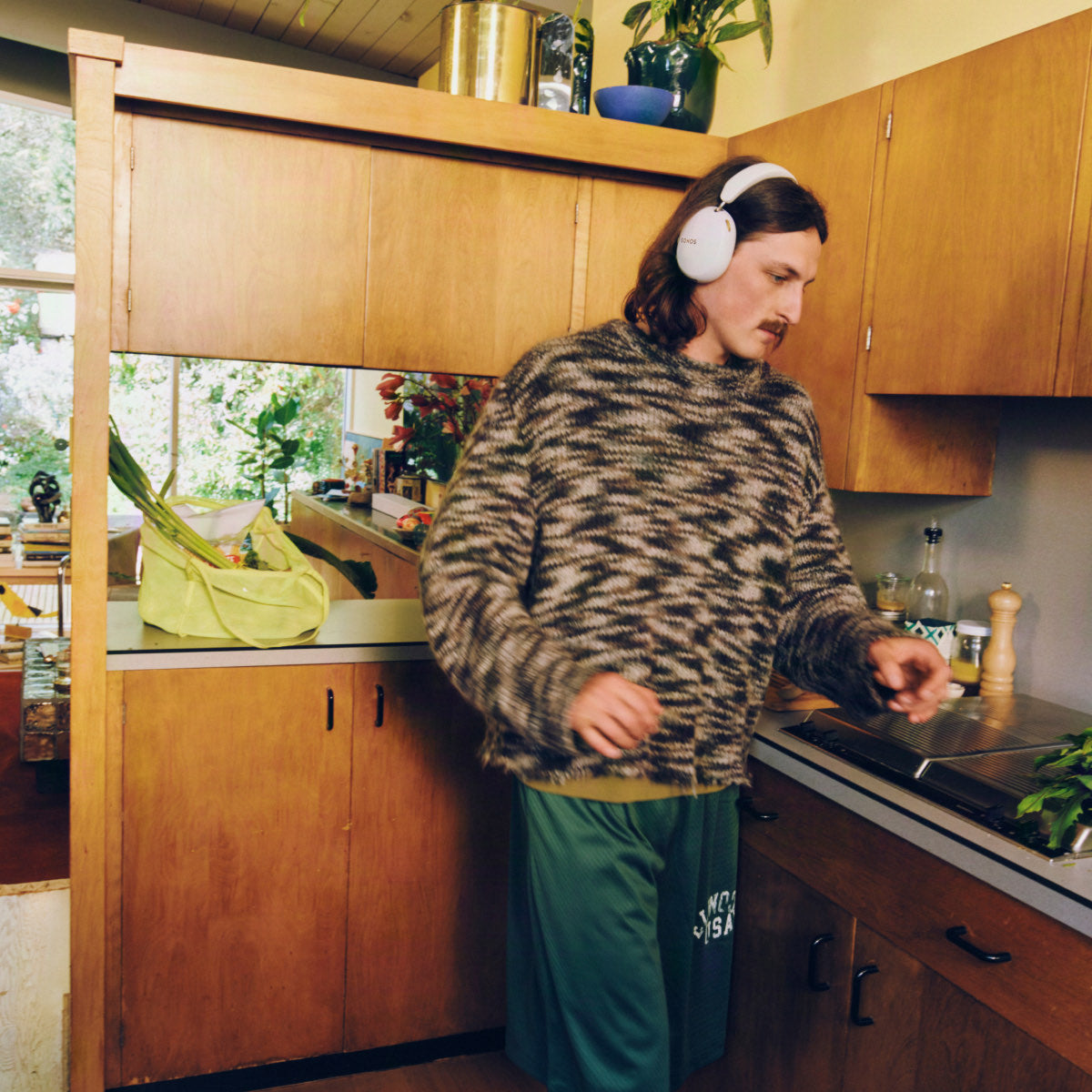Wearing Sonos Ace Ultra while moving around the kitchen